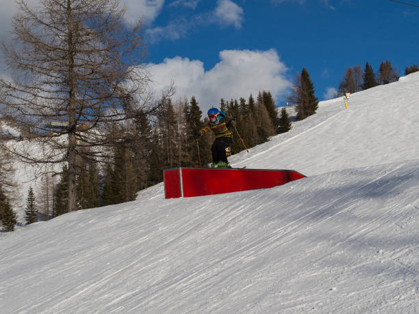 istock Snowboarder in Action: Jumping in the Mountain Snowpark 1127854938