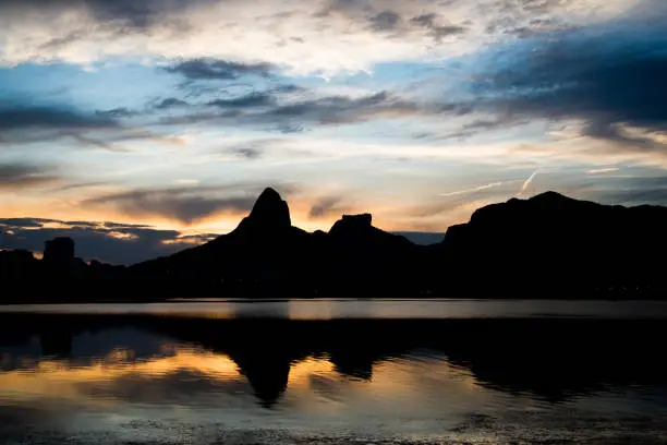 Sunset on the Rodrigo de Freitas Lagoon in the southern zone of Rio de Janeiro, Brazil attracts tourists from all over the world and locals to watch this spectacle of nature