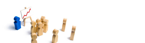 istock The leader is standing near the graph with a red up arrow speaks a speech addressing a crowd of people. Business concept of leader and leadership qualities, crowd management, political debate banner 1127855536