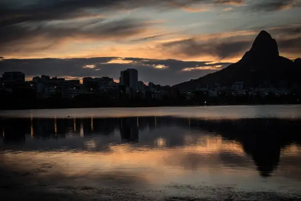 Sunset on the Rodrigo de Freitas Lagoon in the southern zone of Rio de Janeiro, Brazil attracts tourists from all over the world and locals to watch this spectacle of nature