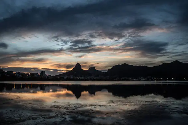Sunset on the Rodrigo de Freitas Lagoon in the southern zone of Rio de Janeiro, Brazil attracts tourists from all over the world and locals to watch this spectacle of nature