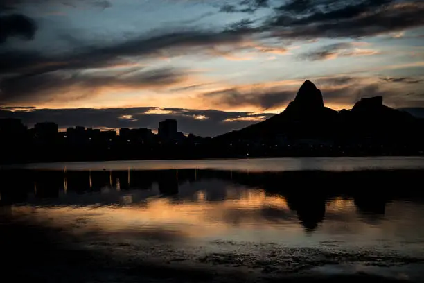 Sunset on the Rodrigo de Freitas Lagoon in the southern zone of Rio de Janeiro, Brazil attracts tourists from all over the world and locals to watch this spectacle of nature