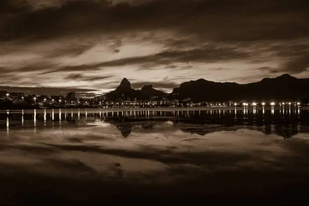 Sunset on the Rodrigo de Freitas Lagoon in the southern zone of Rio de Janeiro, Brazil attracts tourists from all over the world and locals to watch this spectacle of nature