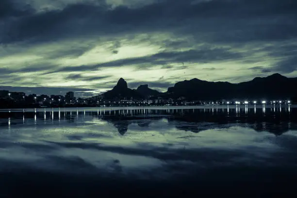 Sunset on the Rodrigo de Freitas Lagoon in the southern zone of Rio de Janeiro, Brazil attracts tourists from all over the world and locals to watch this spectacle of nature