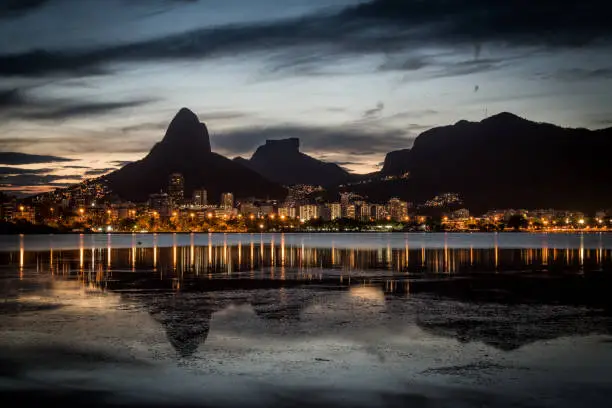 Sunset on the Rodrigo de Freitas Lagoon in the southern zone of Rio de Janeiro, Brazil attracts tourists from all over the world and locals to watch this spectacle of nature