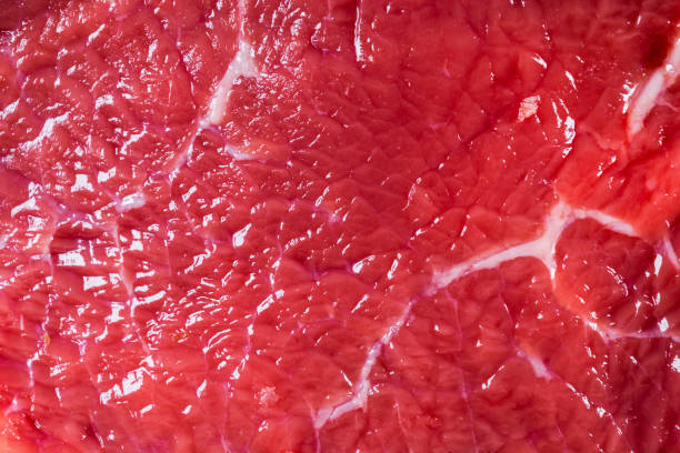 istock Beef raw red meat closeup texture background. Fresh beef piece in closeup. Marbled meat texture. Raw fillet of beef steak. 1127858789