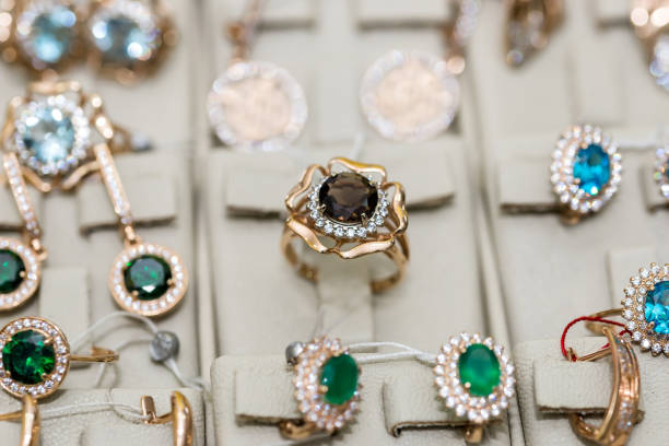 istock Jewellery with gemstones at showcase in store 1127864576