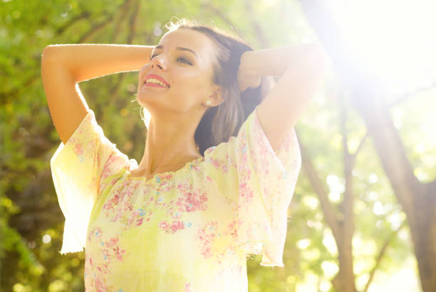 istock Woman in the summer nature 1127865909