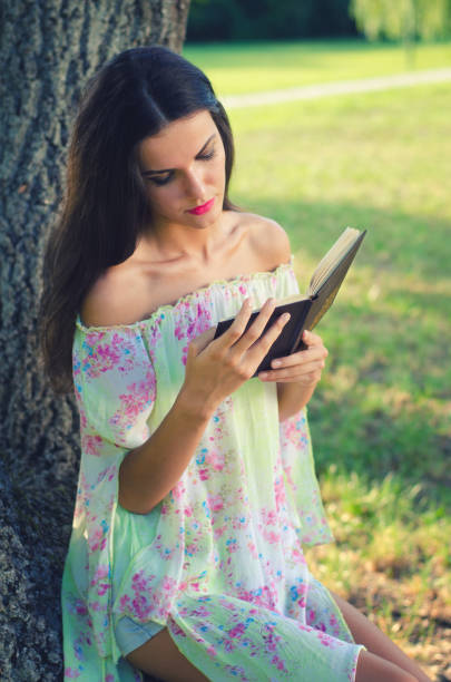 istock Woman in the summer nature 1127866095