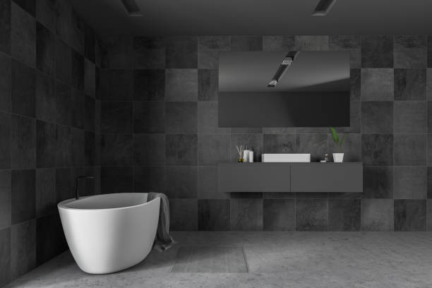 istock Black tile bathroom interior, tub and sink 1127866114