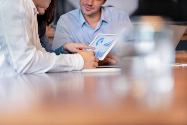 istock Business people working on financial data on a digital tablet. 1127866564