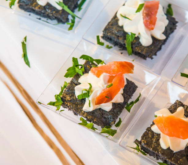 istock small croutons with black bread, salmon and butter cream 1127867453