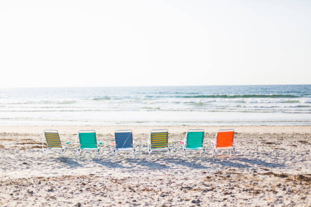 istock A row of chairs on the beach 1127871333