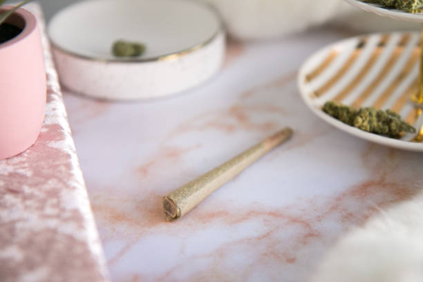istock Close-up on Marijuana Joint on Pink Marble Vanity Luxury Cannabis 1127872529