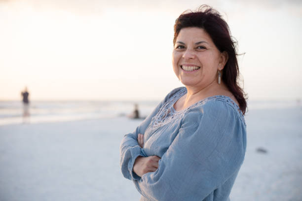 istock Happy mature hispanic woman 1127873619