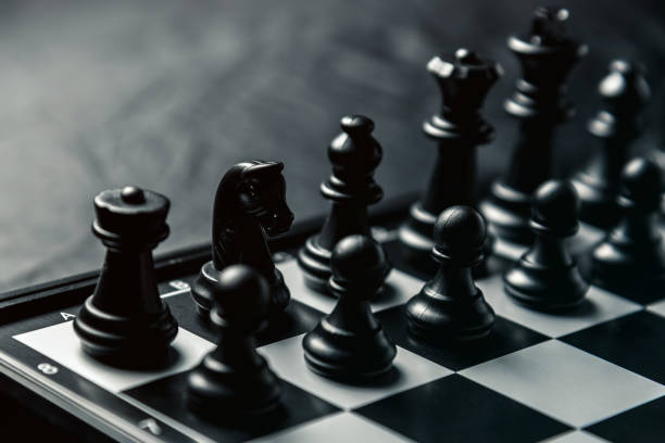 istock Chess board with black chess in the starting position 1127874808