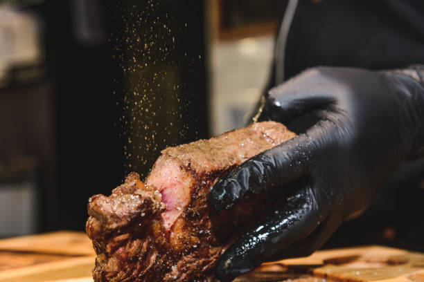 istock a piece of fried meat in the hands 1127876551