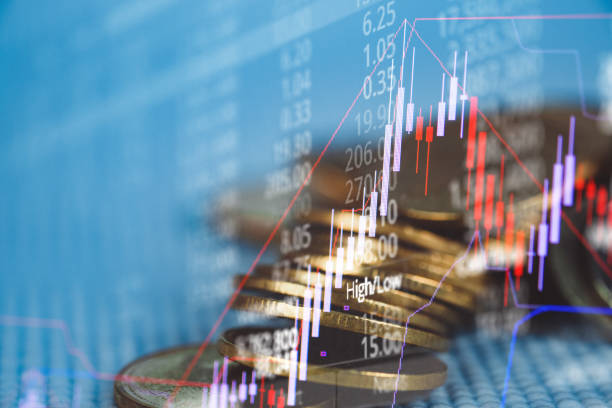 istock Double exposure of coin stack with stock market screen chart board and candle stick for financial business and investor analysis concept 1127877562