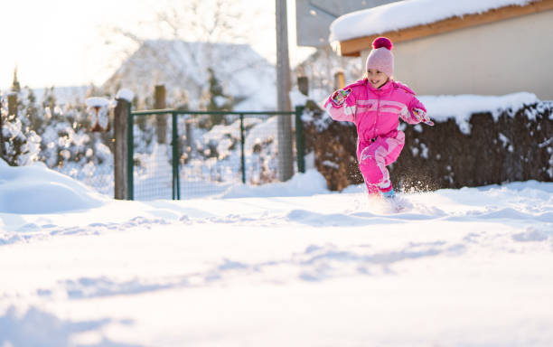 istock Cute girl on snow 1127878327