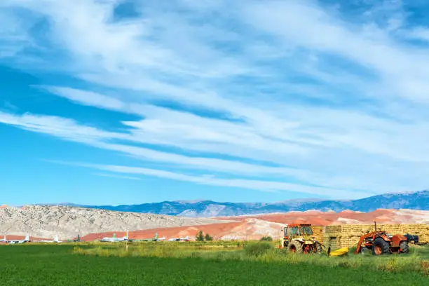 Landscape featuring tractors and an airplane boneyard in Greybull, Wyoming