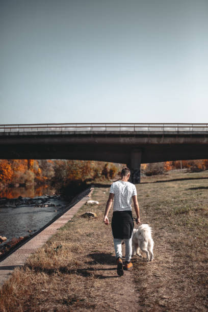 istock Walking by the riverbank in nature 1127878715