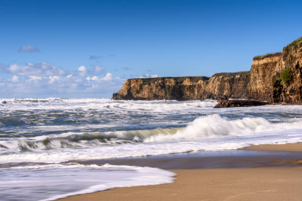 istock Turbulent Ocean Waves On Beach Off California Coast 1127878766