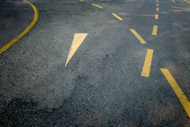 istock High Angle View Of Arrow Symbol On Road 1127879582