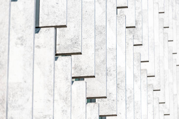 Abstract pattern closeup of modern architecture building with white vertical lines facade exterior contemporary design