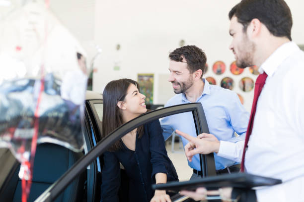 istock Couple Happy With Excellent Features Of Car 1127881663