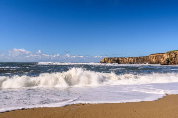 istock Turbulent Ocean Waves On Beach Off California Coast 1127883827