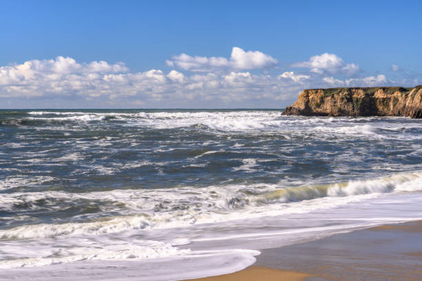 istock Turbulent Ocean Waves On Beach Off California Coast 1127885429