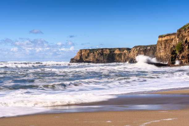 istock Turbulent Ocean Waves On Beach Off California Coast 1127886929