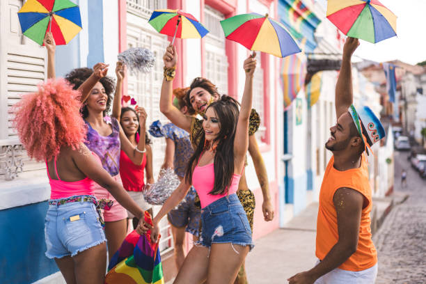 istock Young people dancing at street carnival 1127887619