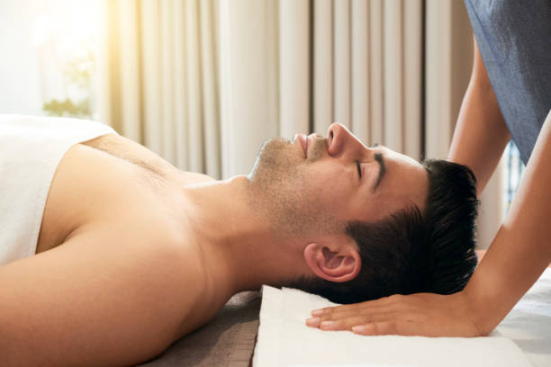 istock Man relaxing in wellness center 1127888166