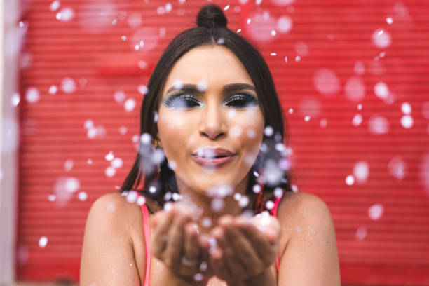 istock Women having fun with glitters 1127888226