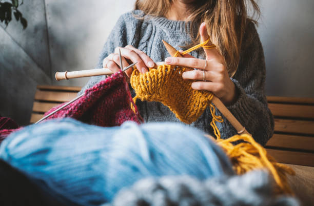 Close up on woman's hands knitting