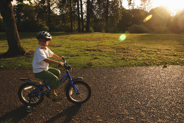 istock Little Boy on Bike with Training Wheels 1127889523