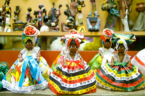 Colorful, souvenir, fridge magnet figurines of women from bahia in traditional dress on display Salvador, Bahia, Brazil