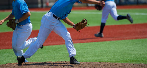 istock Low Section View Of Baseball Players Standing On Playing Field 1127891024