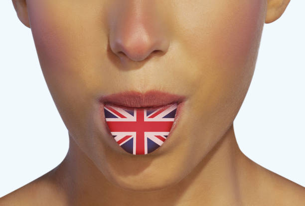 istock Sticking out tongue with UK flag 1127891161