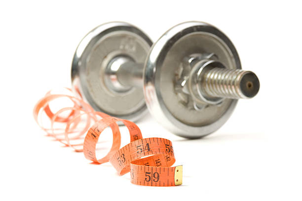 istock dumbbell and measuring tape 112789311