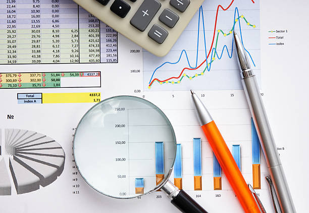 istock magnifying glass and the working paper 112789329