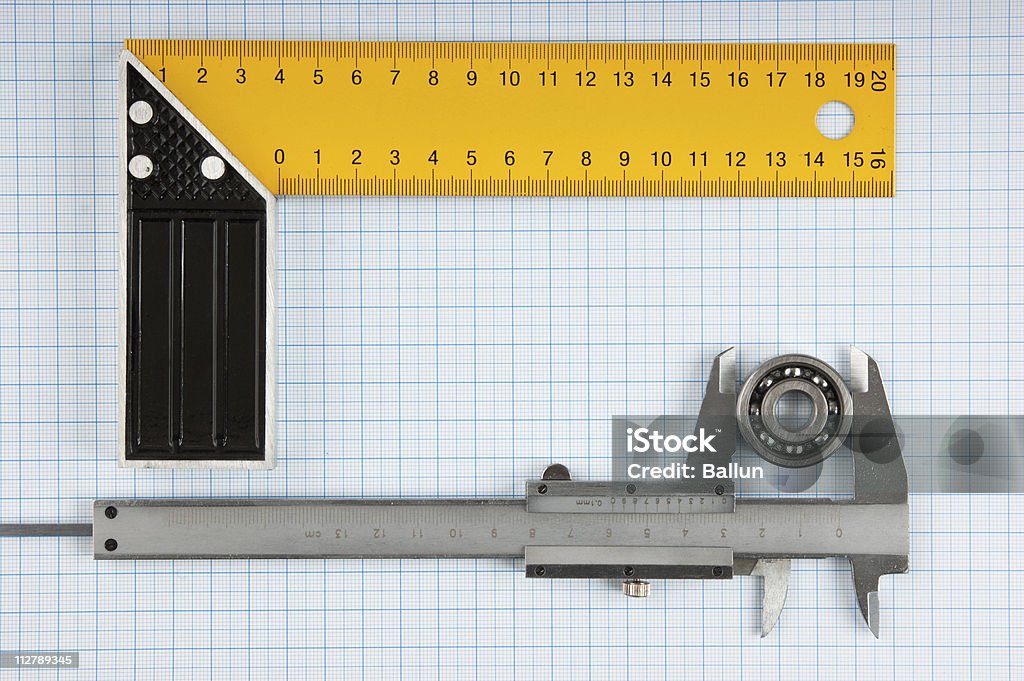 setsquare und calliper mit halten - Lizenzfrei Ausrüstung und Geräte Stock-Foto