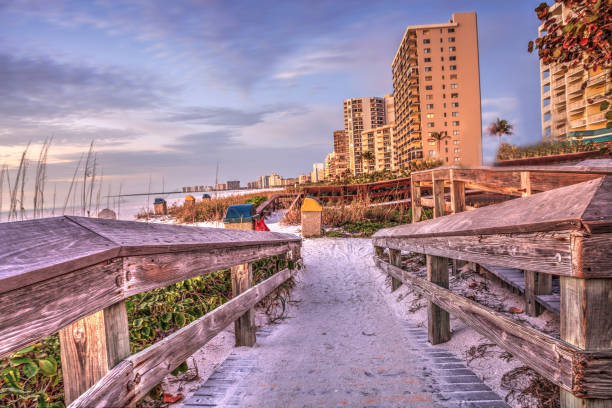 Boardwalk leading down to South Marco Island Beach at Sunset Boardwalk leading down to South Marco Island Beach at Sunset in Florida marco island stock pictures, royalty-free photos & images