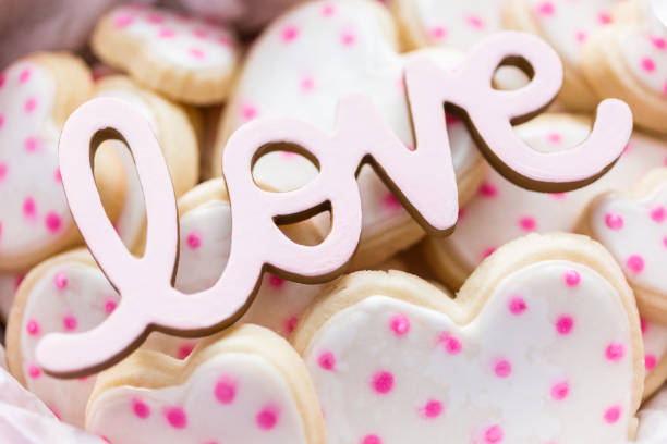 istock Heart shaped sugar cookies decorated with royal icing in gift box 1127895408
