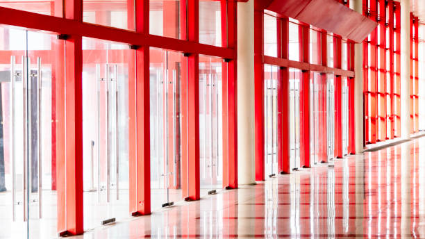 istock red glass and metal wall in modern building 1127895416