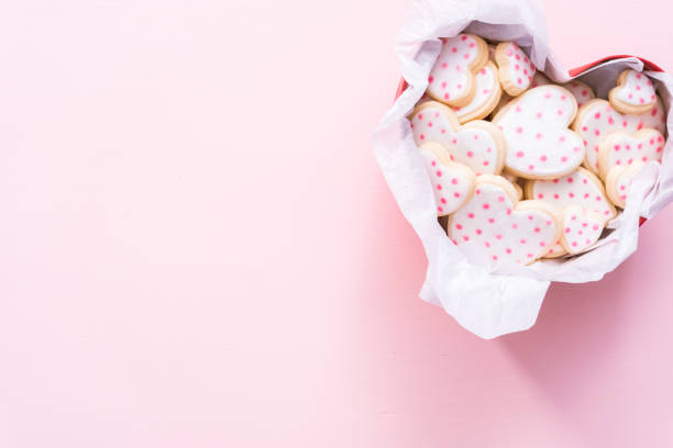istock Heart shaped sugar cookies decorated with royal icing in gift box. 1127895418