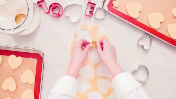 istock Cutting out shapes from sugar cookie dough 1127895615