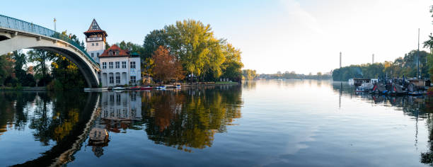 istock calm river with bridge in early morning light 1127896327