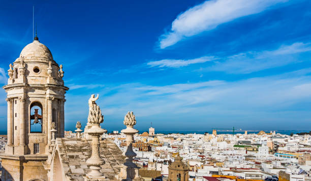 Bell tower of Cadiz Cathedral and aerial view of the western city and Bay of Cadiz Bell tower of Cadiz Cathedral and aerial view of the western city and Bay of Cadiz in the background faro district portugal photos stock pictures, royalty-free photos & images
